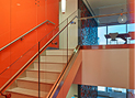 clear low-iron glass used as a stair railing