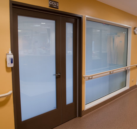 Example of a glass hospital door after InstaVue is powered on showing the now private, translucent door